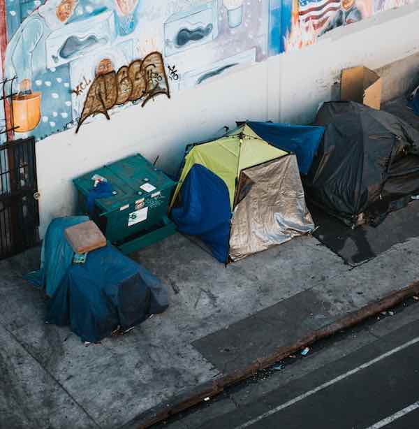 A row of Homeless people's tents on publis sidewalk