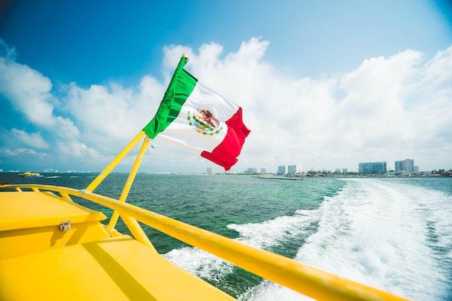 Boat in water with Mexican flag